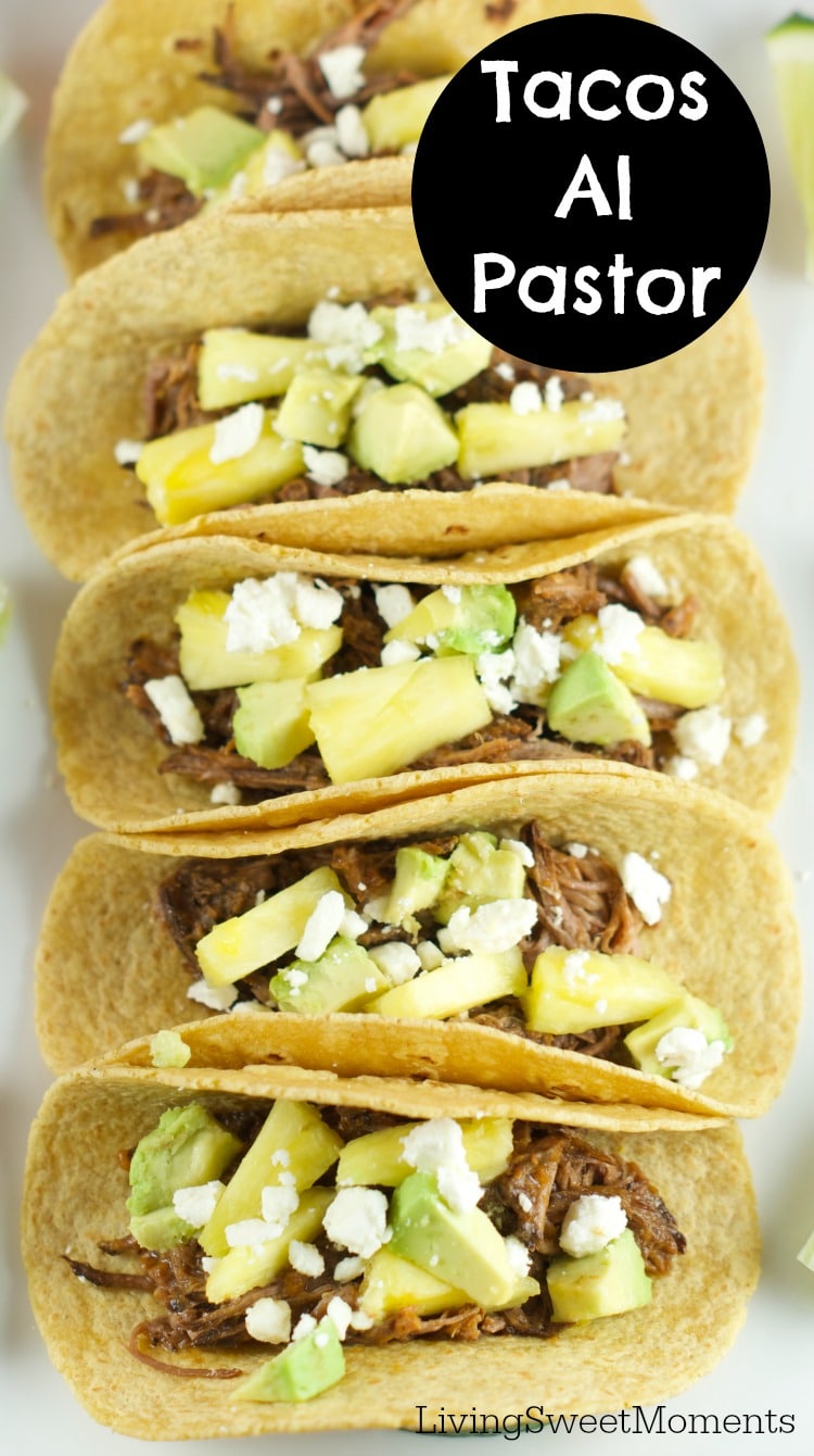 Tacos Al Pastor - These easy beef tacos al pastor are made in the slow cooker. Shredded beef topped with pineapple chunks, cheese and avocados. Delicious! 
