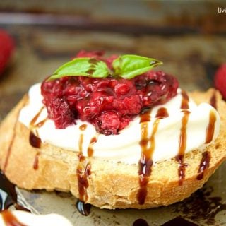 This delicious Roasted Raspberry Crostini recipe is made with balsamic vinegar, mascarpone cheese on top of a baguette. The perfect summer appetizer.